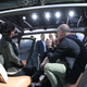 NIO staff chats inside the car. Photos and reporting from Stef Schrader for Jalopnik